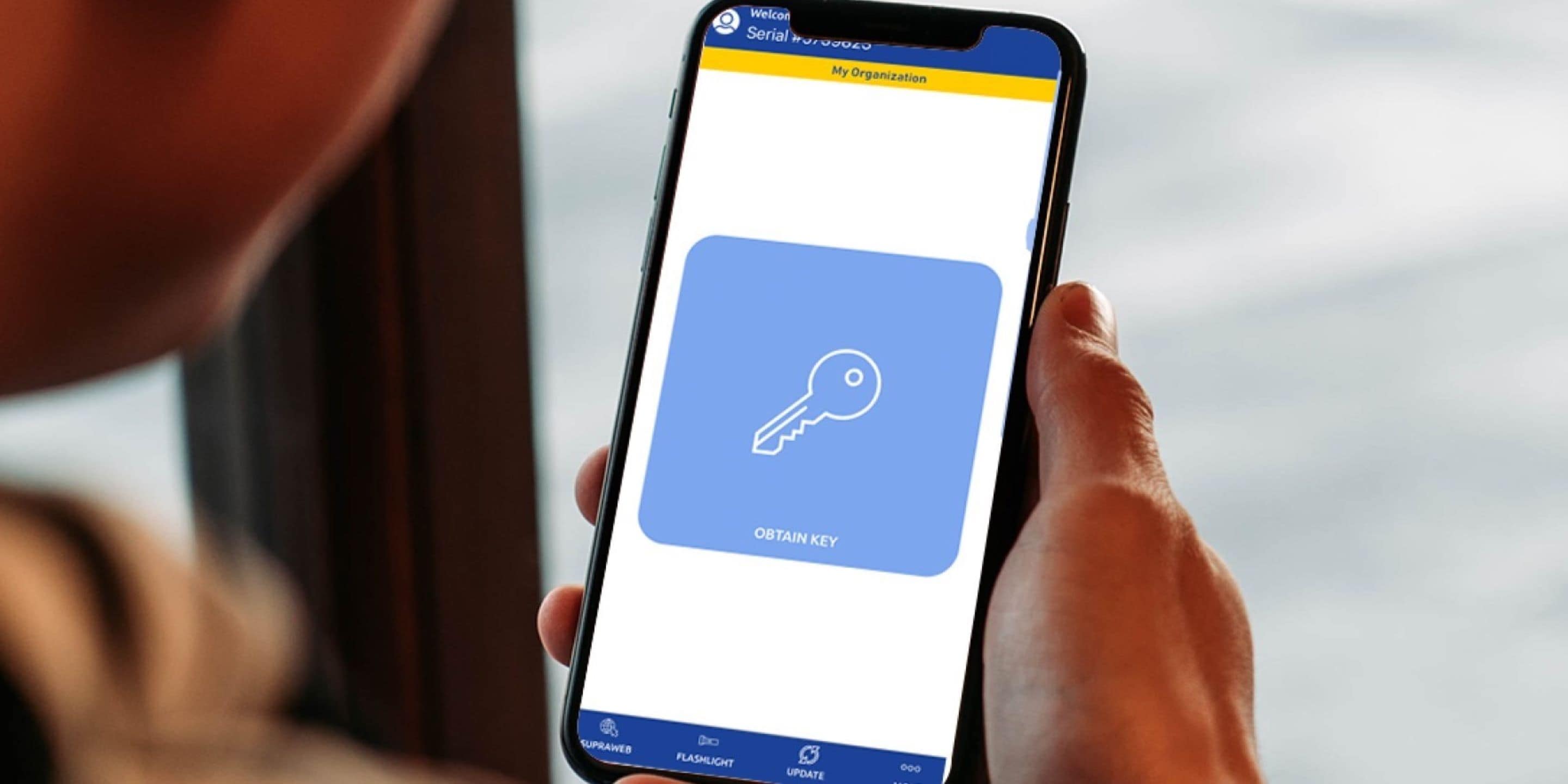 Supra eKEY app with large obtain key button for managed access on mobile phone.