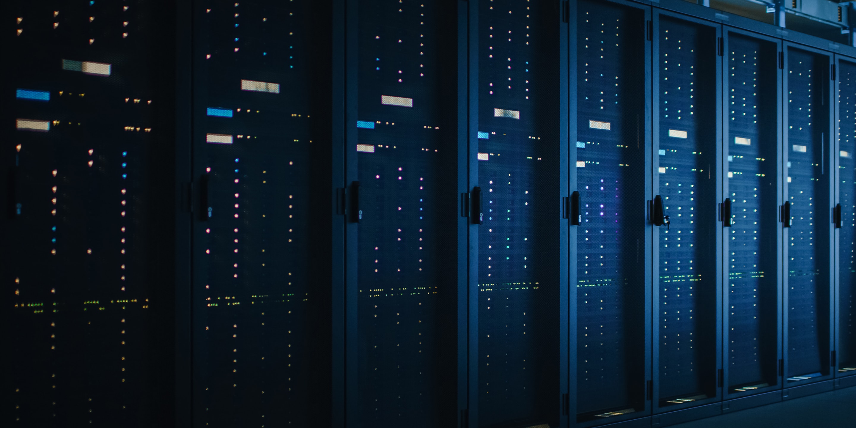 Shot of Dark Data Center With Multiple Rows of Fully Operational Server Racks. Modern Telecommunications, Cloud Computing, Artificial Intelligence, Database, Supercomputer.